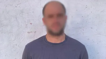 Обкрадав будинки, поки люди були в укритті: у Києві на Подолі затримали квартирного злодія - фото