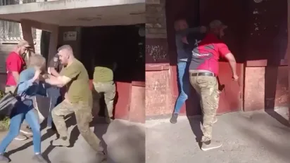 Силою відтягнув жінку від під'їзду: у Львові конфлікт із представниками ТЦК - фото